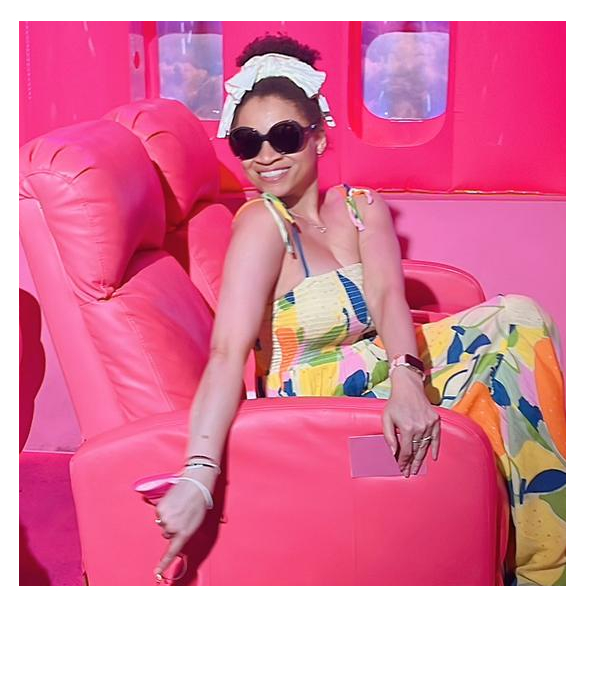 Ronni in a pink chair